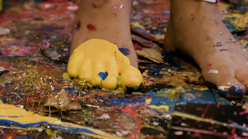 Creative Kid Painting with Feet